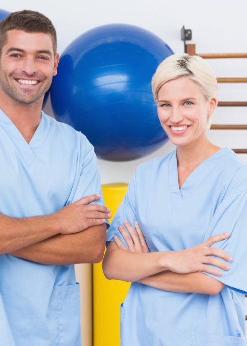 Team of therapists with arms crossed smiling at camera 455277