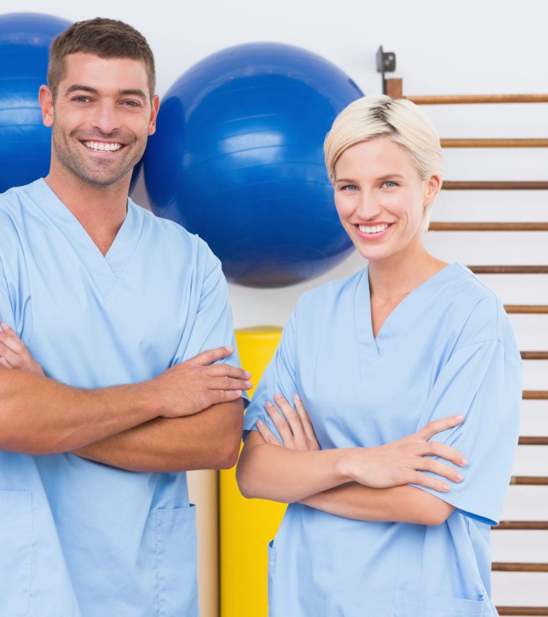 Team of therapists with arms crossed smiling at camera 455277